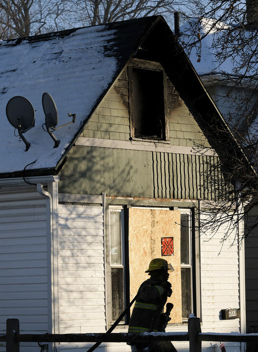    Spot News - HM   - Firefighters on the scene at 4048 Peak Avenue where a vacant home caught on fire in Toledo. Arson is suspected. (Jeremy Wadsworth / The Blade)